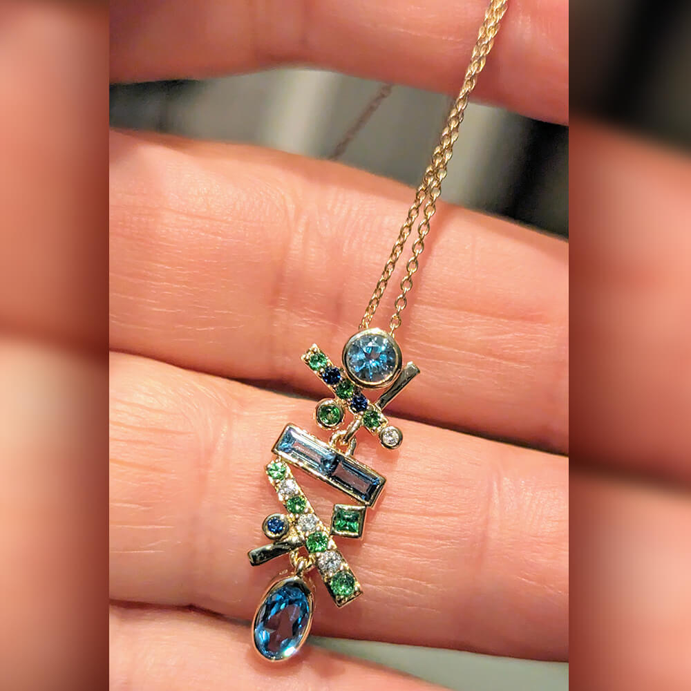 martha-seely_MSN030_falling-stars-blue-green-pendant_model